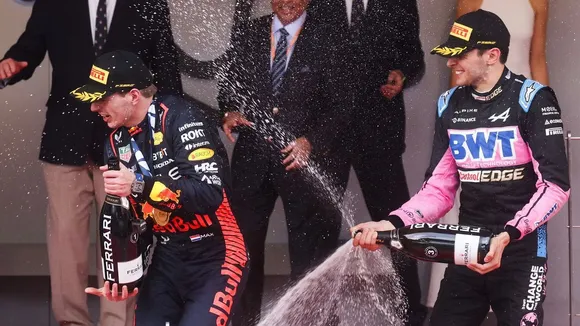 Esteban Ocon with Max Verstappen