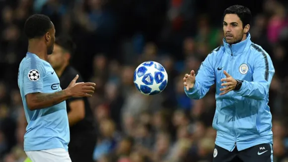 Mikel Arteta and Raheem Sterling