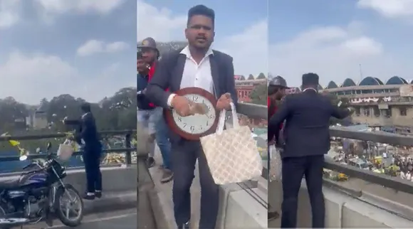 Bengaluru, Bengaluru news, Bengaluru Man, Bengaluru man throws notes, பெங்களூருவில் பண மழை பொழிந்த கடிகார மனிதன், பணத்தை அள்ள முண்டியடித்த மக்கள் கூட்டம், Man throws currency notes from Bengaluru flyover like Money rainman throws currency notes, currency notes Bengaluru flyover, Bengaluru man police action, Bengaluru police, indian express, news