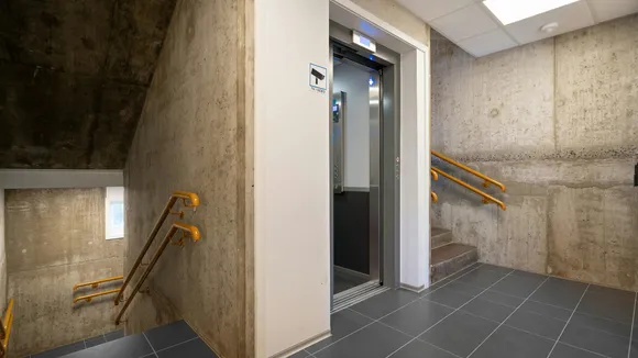 How Elevators, Bollards, and Sectional Doors Work Together in Modern Infrastructure