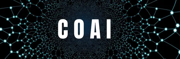  A close-up of a spider web with the misspelled word coai written in white in the center