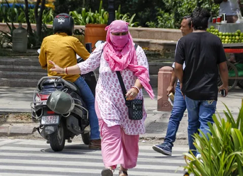 A woman wears a scarf
