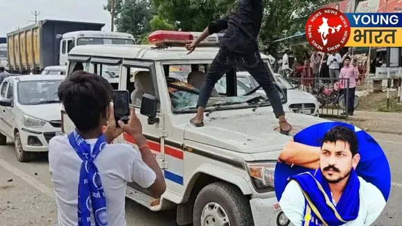 Rioters vandalizing police vehicle
