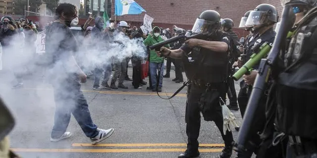 Protester pulls gun as ICE raid turns violent in California