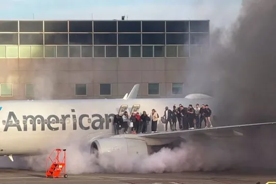 Passengers evacuated after American Airlines plane catches fire at Denver Airport