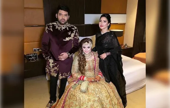 Pics: रिसेप्शन में कपिल शर्मा ने पहनी महरून शेरवानी तो हरे रंग के लंहगे में नज़र आईं गिन्नी चतरथ