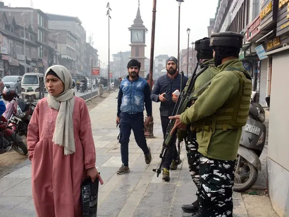 Srinagar: Security personnel stand guard as security is beefed up following the Supreme Court's verdict on the batch of petitions challenging the abrogation of Article 370 in Jammu and Kashmir, at Lal Chowk in Srinagar on Monday, December 11, 2023. (Photo: IANS/Umar Qadir)