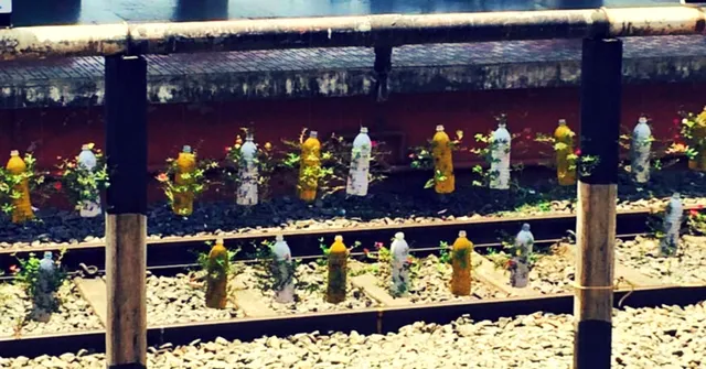 VIDEO: Bottles Thrown out by Passengers Are Being Used as 'Plant Barricades' at This Railway Station