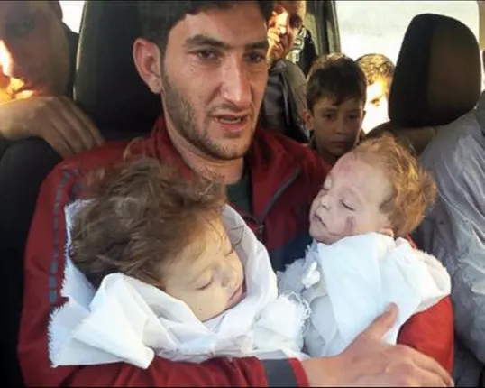 ବିଶ୍ୱକୁ ଆନ୍ଦୋଳିତ କଲା ସିରିୟାର ଦୁଃଖଦ ଫଟୋ ! ବାପା ହାତରେ ଦୁଇ କୁନି ଝିଅଙ୍କ ମୃତଦେହ