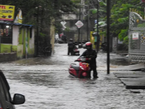 [In Pics] Heavy downpour throws life out of gear in Odisha capital