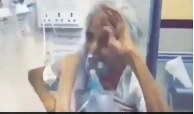 ଦେଖନ୍ତୁ ଅକ୍ସିଜେନ ମାସ୍କ ପିନ୍ଧି କିପରି କରୋନା ସଂକ୍ରମିତ ବୃଦ୍ଧା ଖୁସିରେ କରୁଛନ୍ତି ନୃତ୍ୟ