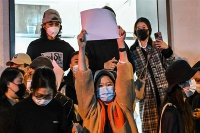 China Protest: Police accused of assaulting journalist