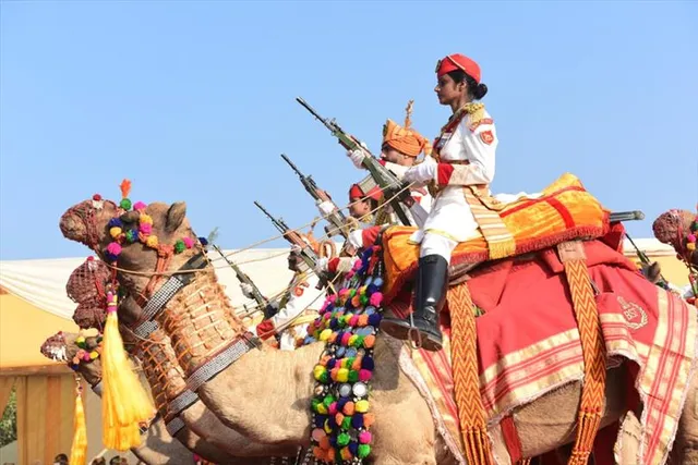 Female guards dressed in royal attire at the famous BSF Camel Contingent