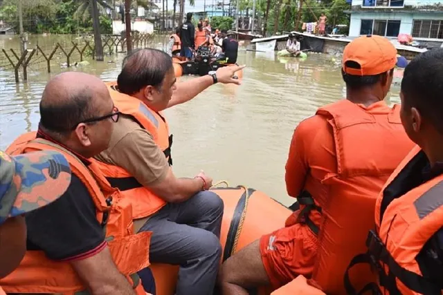 Himanta walks through flooded Silchar streets