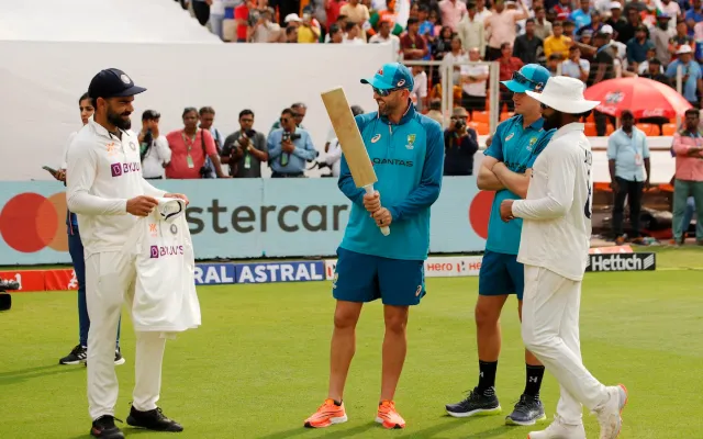 Virat Kohli giving his Test shirt to Australia players
