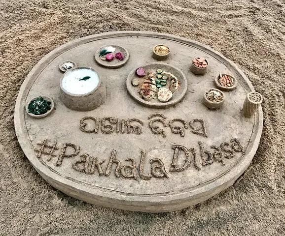 Sudarsan creates sand art on International Pakhala Dibasa in Odisha