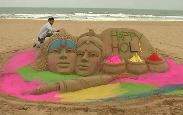 Sand sculpture on Radha-Krishna by Odisha artist for Holi