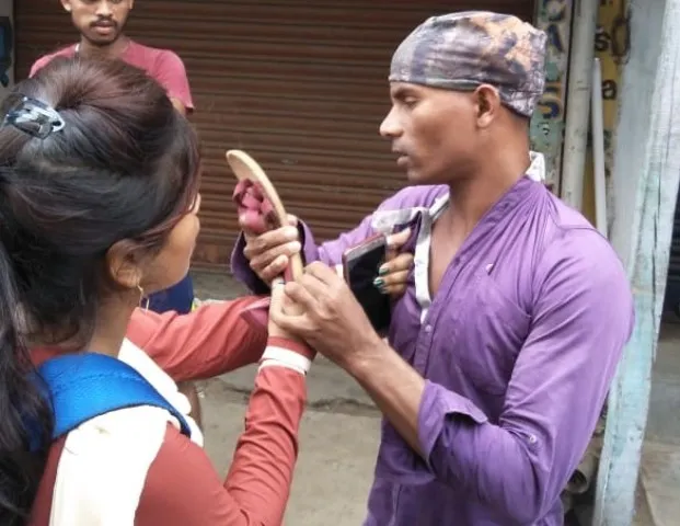 Watch: College girl thrashes stalker on road in Odisha