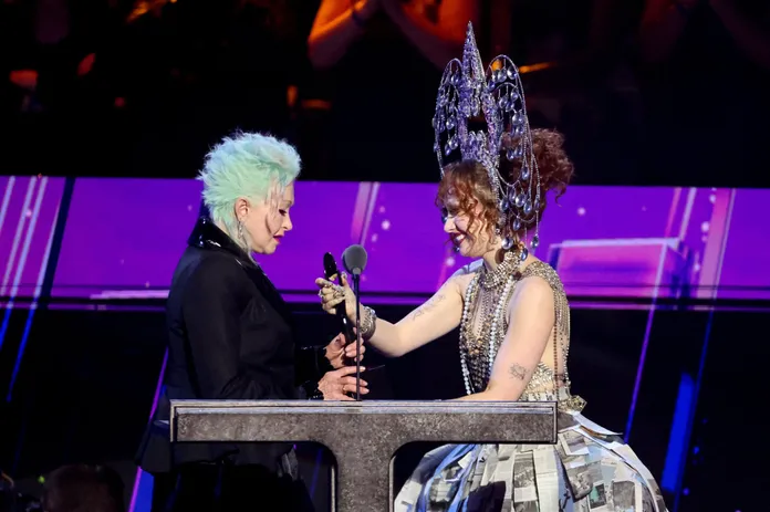 Chappell Roan honors Cyndi Lauper in newspaper skirt at Rock & Roll Hall of  Fame