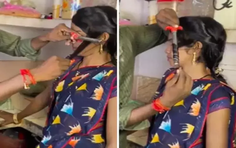 Viral Video: पार्लर का पैसा बचाने के लिए शख्स ने गैस लाइटर की मदद से महिला के बालों को किया कर्ल