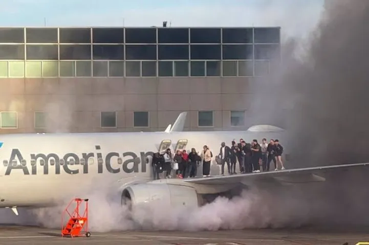 Passengers evacuated after American Airlines plane catches fire at Denver Airport