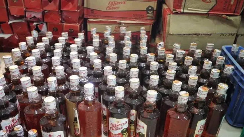 Ahmedabad Police unearth liquor bottles buried in pots at Chandkheda plot