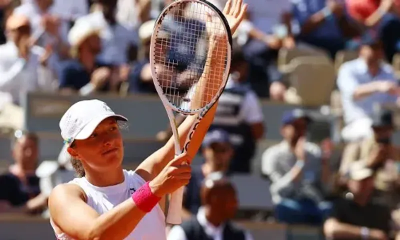 French Open: Top seed Iga Swiatek thrashes China's Wang Xinyu to reach fourth round