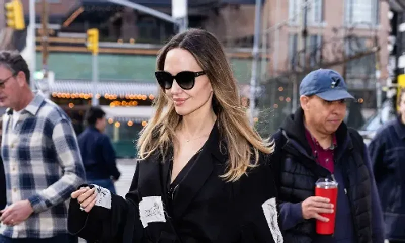 Angelina Jolie switches up her signature style with a patchwork coat