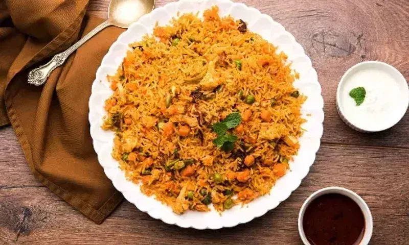 Make Veg Biryani, an authentic Indian vegetarian recipe full of your favorite rice, veggies and spices at home