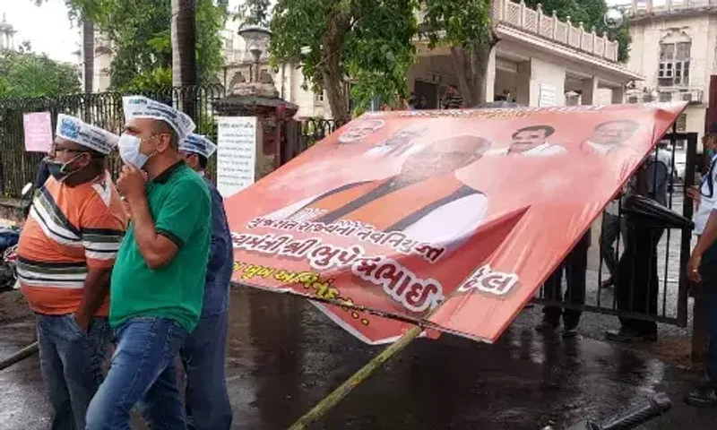 Aam Admi Party protest against removal of their hoarding at Gorwa area in Vadodara