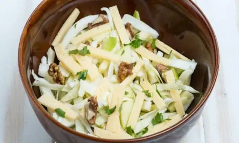 Zad Apple Salad with Winter Greens Recipe: This interesting salad recipe is a flavoursome combination of Indian fruits and veggies