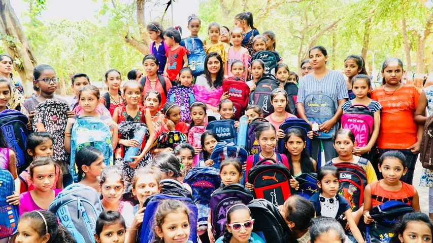 Social worker Nishita Rajput distributes school bags water bottles to girls in Vadodara