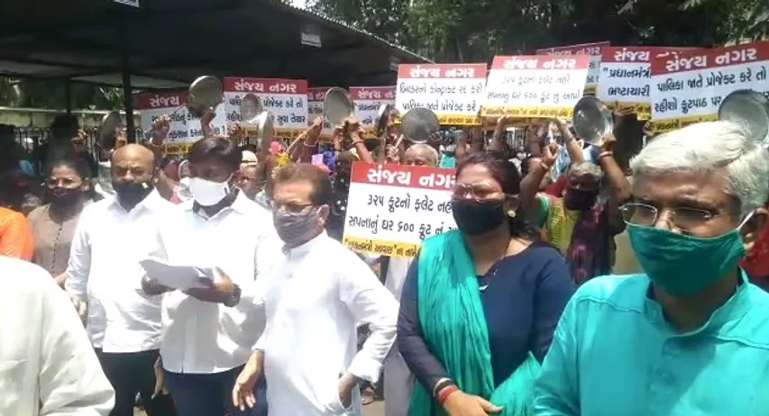 Displaced residents of Sanjay Nagar slums in Vadodara beat plates inside VMSS compound