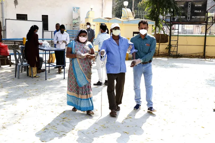 Blind voter Bharat Thakor cast his vote in Vadodara with family