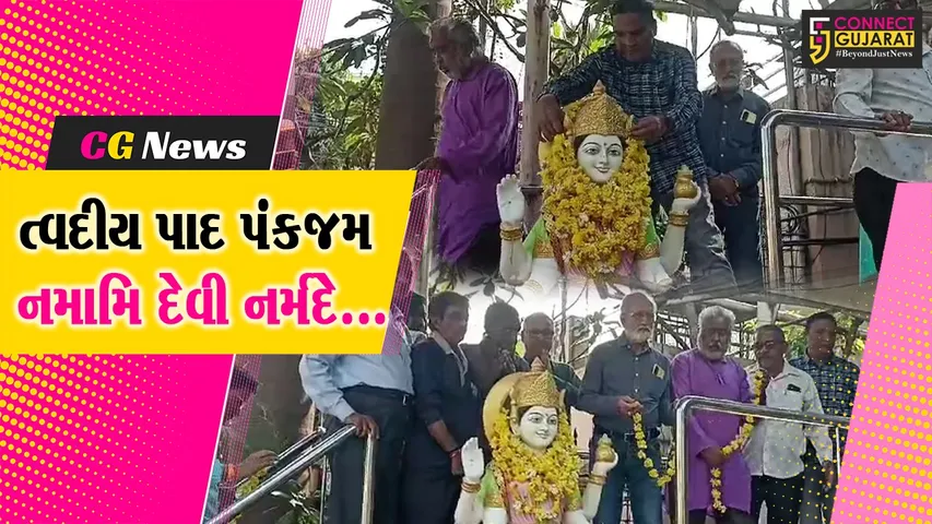 Offering flowers to the statue of Mother Narmadaji