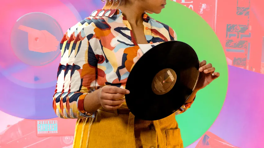 A woman holds a vinyl record in her hands to show how vinyl bars India and vinyl cafés India are popularising vinyl culture India, besides vinyl listening rooms India that are highlighting analogue sound India