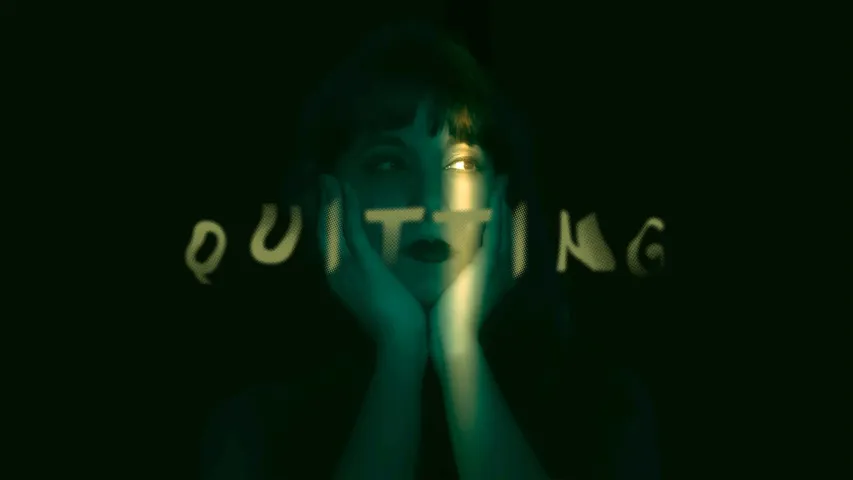 A woman sits and ponders with the word quitting on top of it to show how Gen Z burnout is being dealt with especially since burnout culture is going beyond impacting just Gen Z mental health, leading to even millennials being a quiet quitting generation