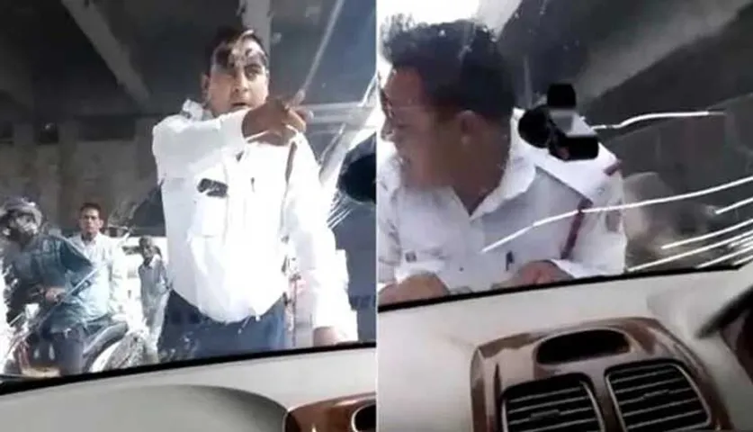 ଚଳନ୍ତା କାର୍‌ର ବନେଟ୍‌ ଉପରେ ଚଢ଼ିଗଲେ ଟ୍ରାଫିକ୍ ପୁଲିସ୍, ଭାଇରାଲ୍‌ ହେଉଛି ଭିଡିଓ