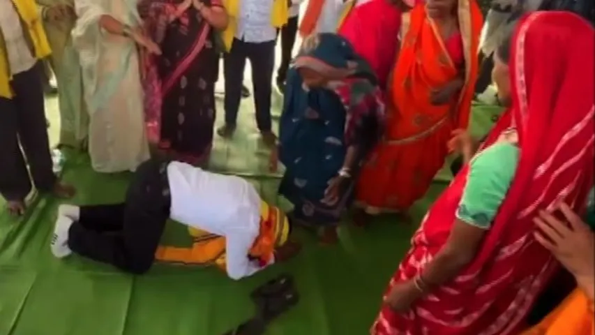 Congress candidate Ghasiram Majhi pleads for votes in a unique way