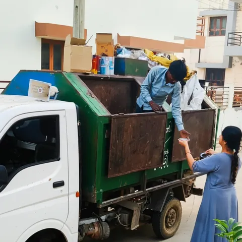 Woman serves tea to sanitation worker