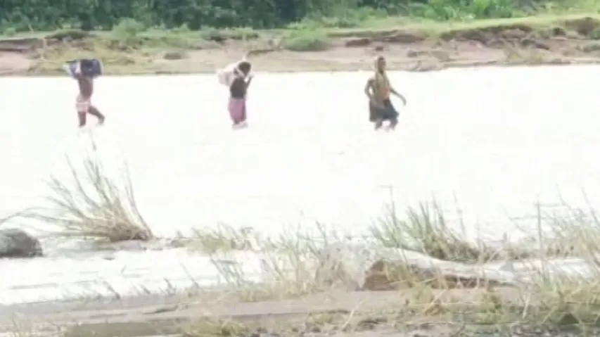 Watch: Family Risks Everything To Cross Flooded River To Save Son