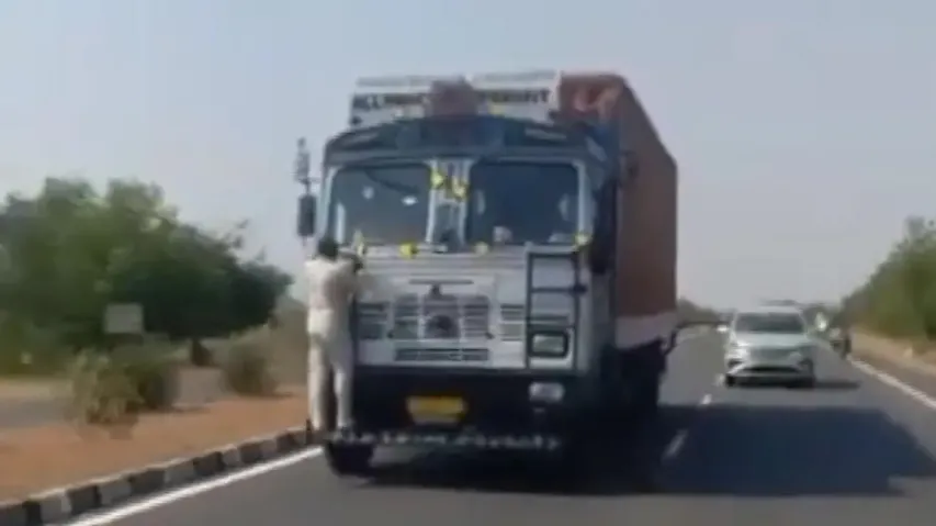 Watch! Tollgate staff clings for life as he is hauled for 10 kms on truck bumper