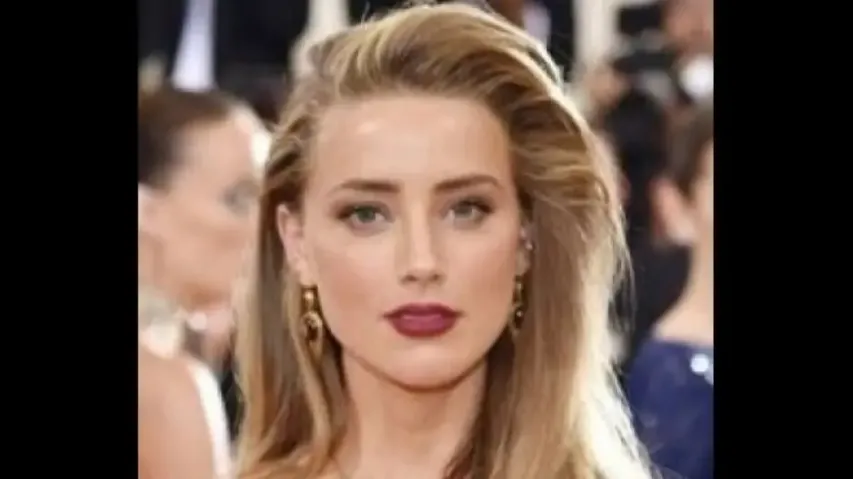 Amber Heard says Johnny Depp is a 'beloved character'
