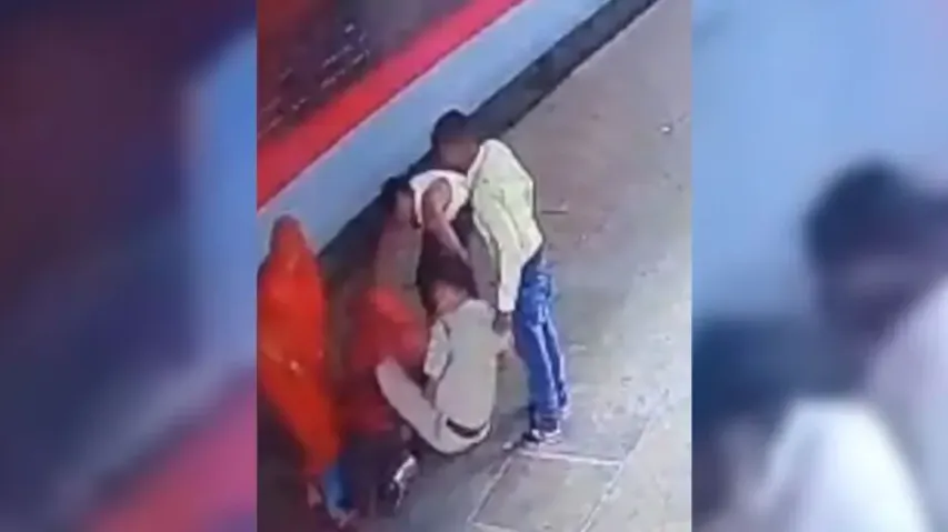 Watch: RPF man saving woman from being run over by train