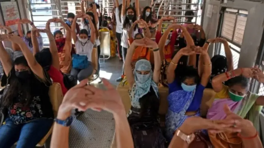 Yoga in train: Mumbai local commuters perform asanas while travelling