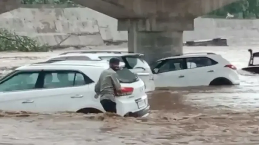 Cars swept away in rain