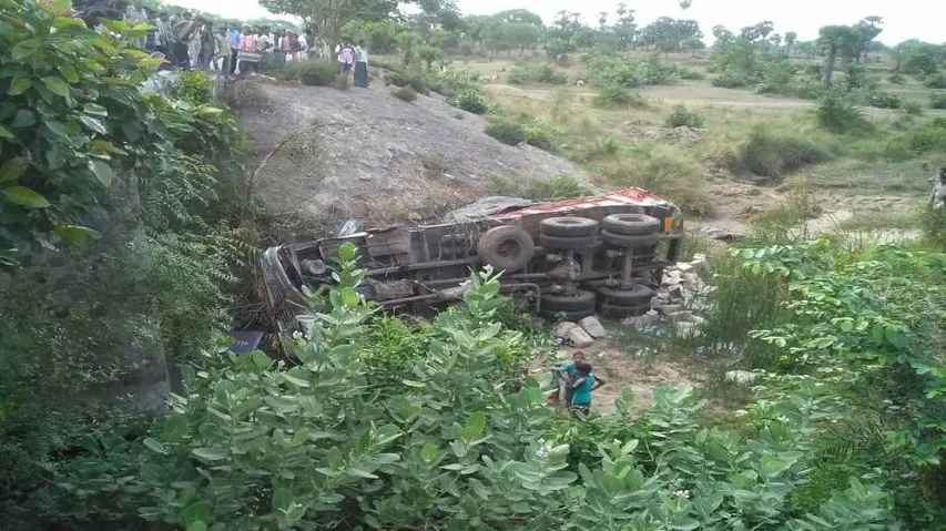 Driver dies as truck falls off 20-feet bridge