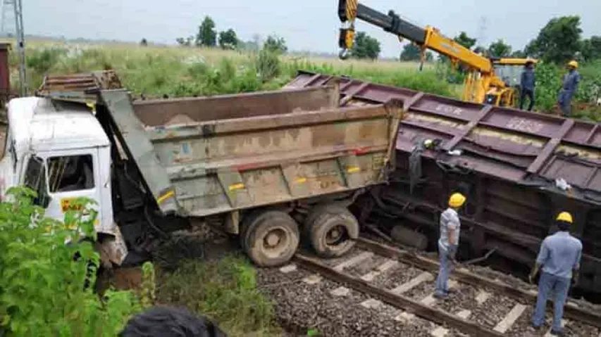 Wagon of goods train derails after hitting truck