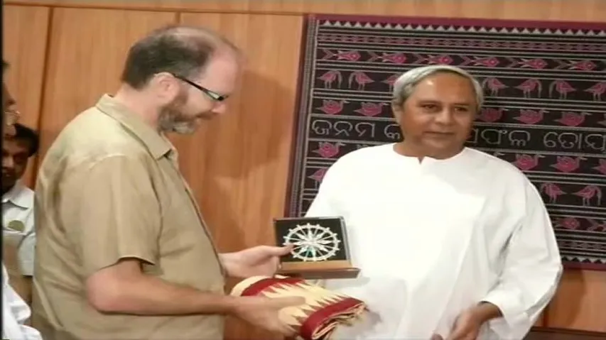 CM Naveen felicitates Prof Diego Andres Golombek