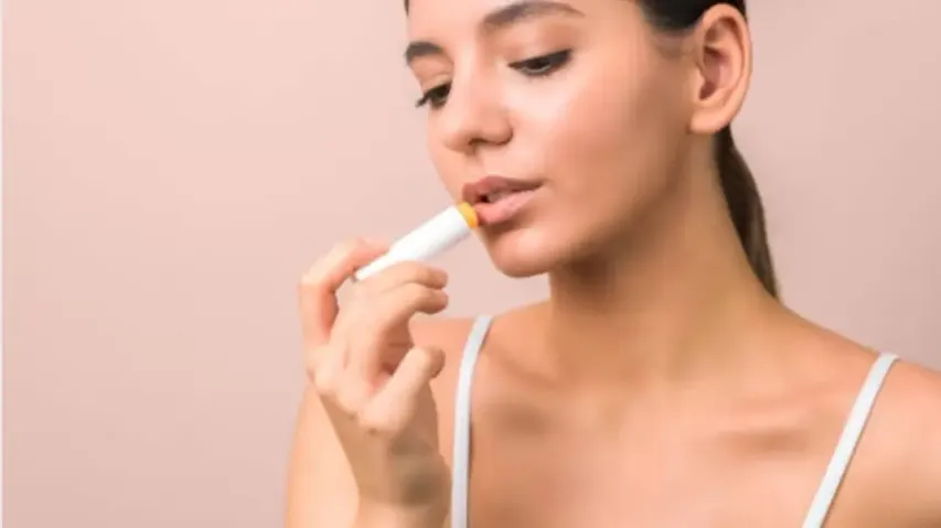 Applying lip balm 